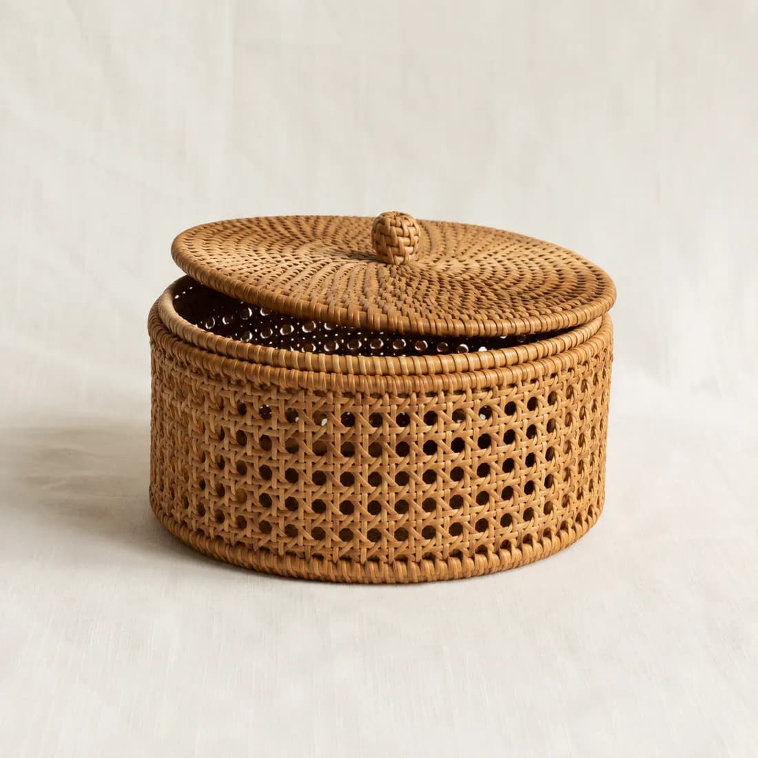 Lidded Basket Ø30 — Rattan, shown empty on a plain linen-white background