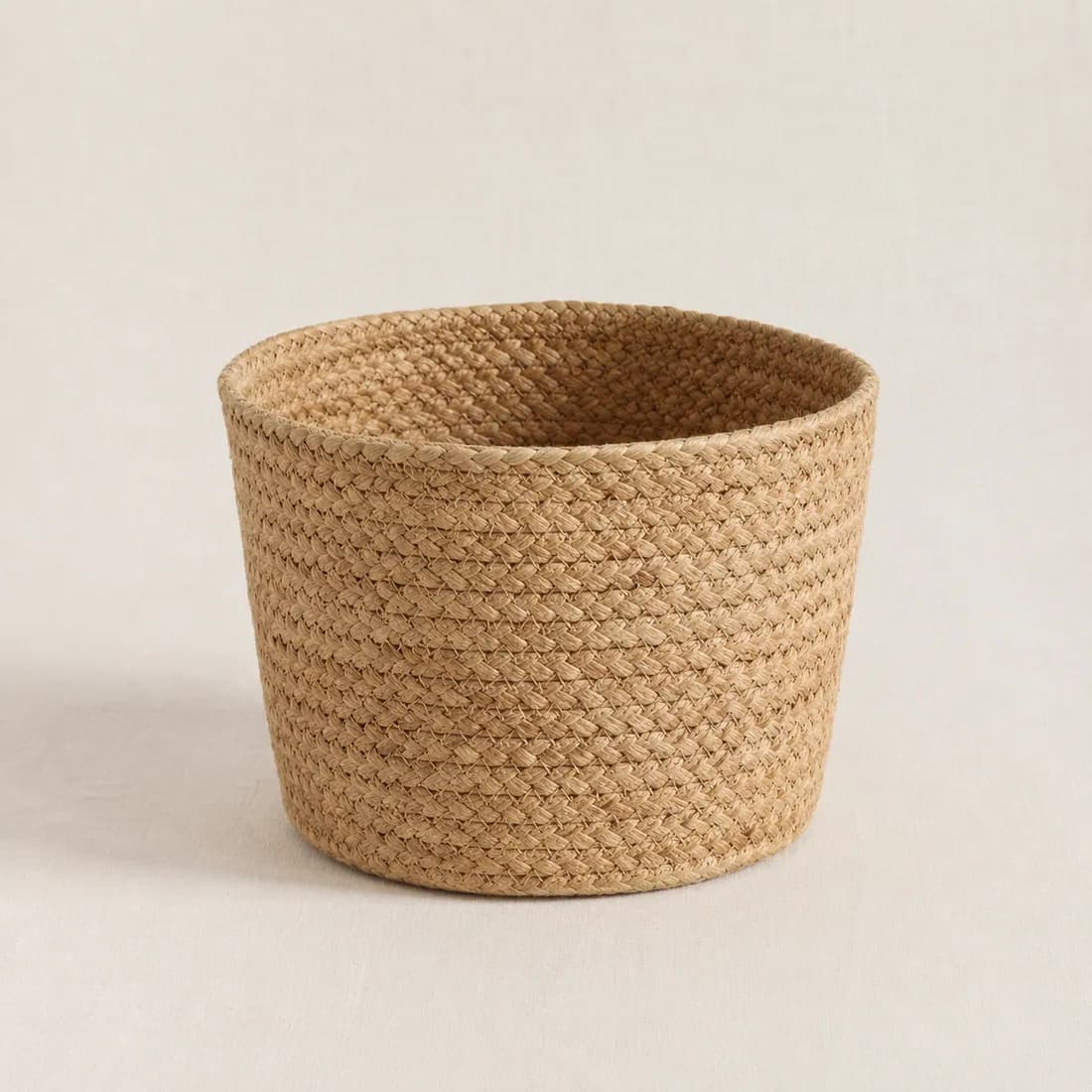Pot Cover Ø24 — Water Hyacinth, shown empty on a plain linen-white background