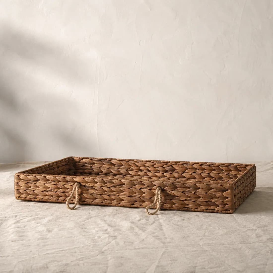Under-Bed Basket 60×40 — Water Hyacinth, shown empty on a plain linen-white background